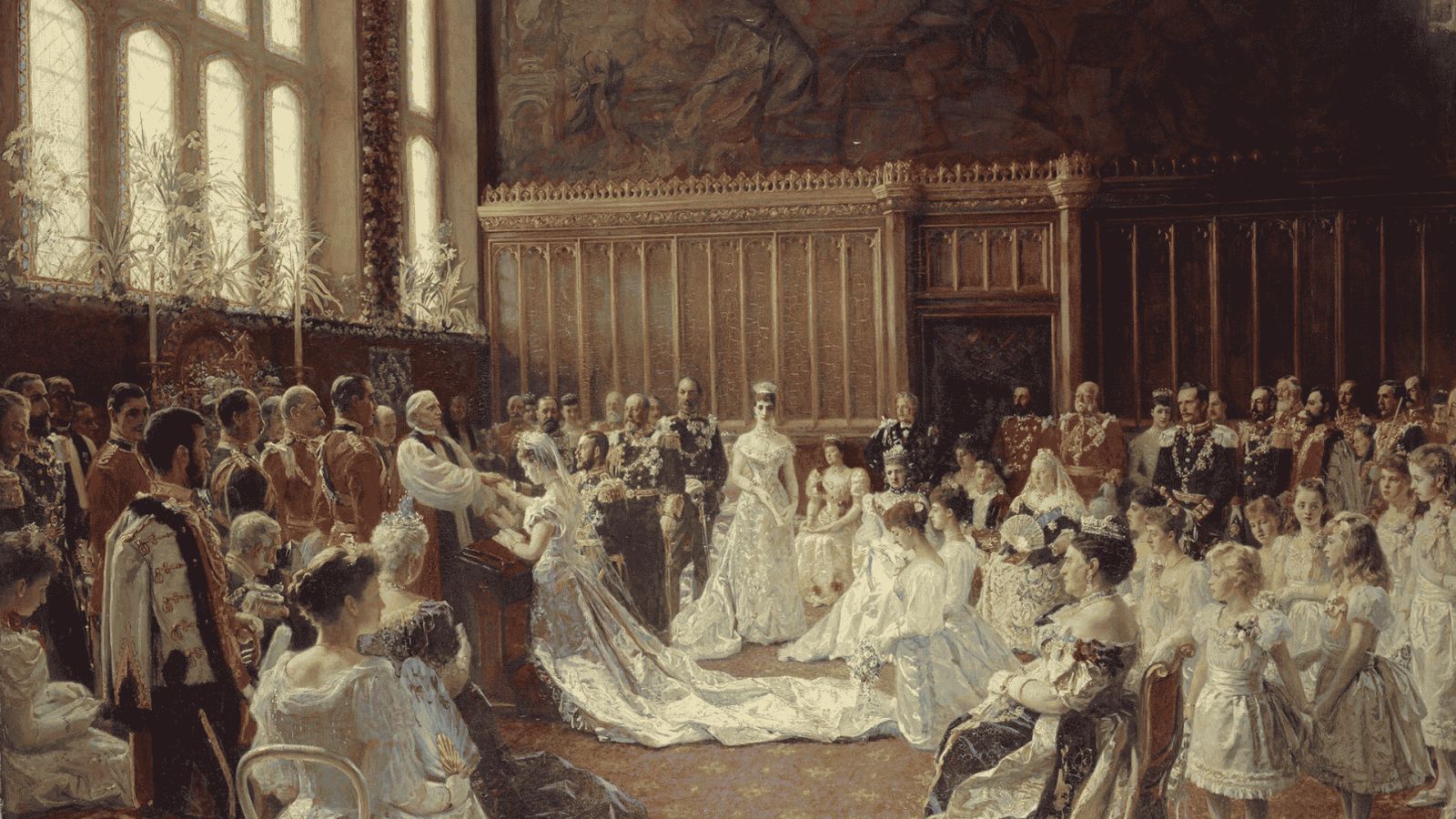 Symbolic of the Edwardian Era in English history, An ornate late-19th-century painting depicting the royal wedding ceremony of Prince George, Duke of York, and Princess Victoria Mary of Teck inside a grand hall. In the center, the bride in a long, flowing white wedding gown and veil kneels before an archbishop in white vestments, holding hands with the groom who is dressed in formal military attire. A vast assembly of distinguished royal family members, noble guests in military uniforms, and bridesmaids in white dresses look on, seated and standing beneath high stone-arched windows and dark, decorative wall panels.