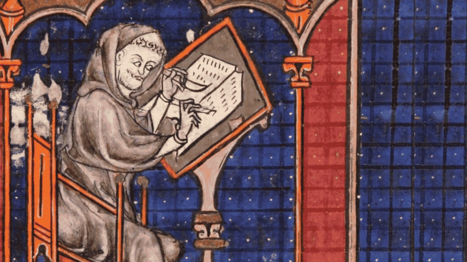 A medieval illuminated manuscript miniature from Durham Cathedral depicting a tonsured monk, often identified as the Venerable Bede, seated at a wooden desk. Wearing a simple brown habit and cowl, he is shown actively writing in an open book with a quill in one hand and a scraping knife in the other. The scene is framed by an architectural stone arch and set against an intricate, blue-and-red geometric tiled background adorned with small white dots.