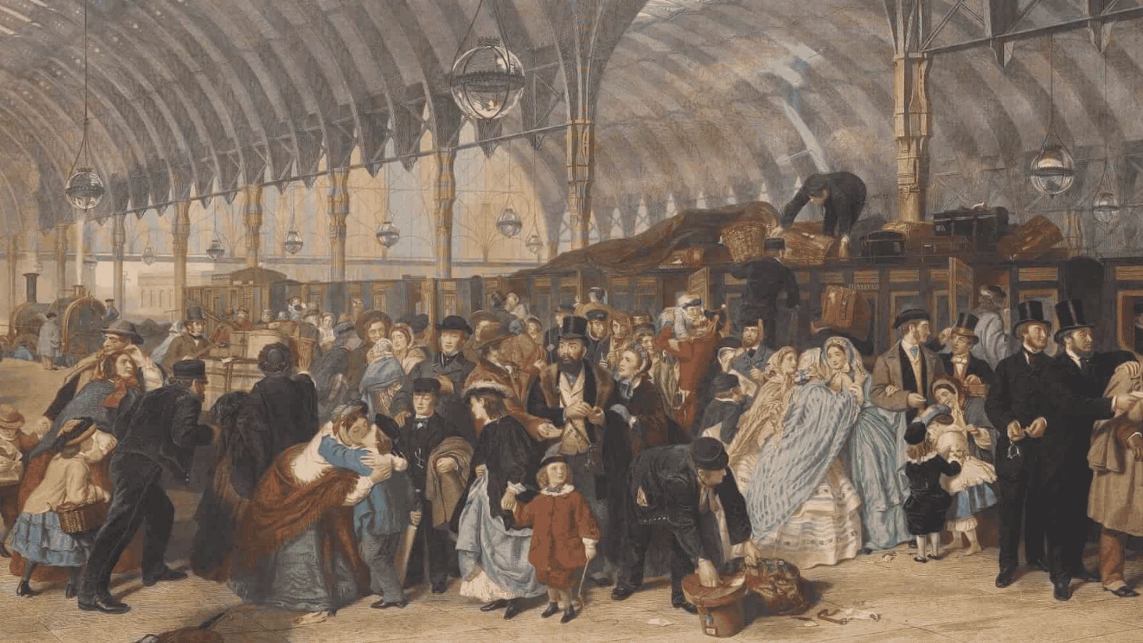 A renowned 19th-century oil painting by William Powell Frith titled The Railway Station, capturing the bustling activity of a London train terminus during the Victorian era. Set beneath a grand, arched iron-and-glass roof with hanging spherical glass lights, the scene features a dense, diverse crowd of travelers dressed in formal Victorian attire, including men in top coats and top hats, and women in elaborate crinoline dresses, shawls, and bonnets. In the foreground, people interact dynamically—families say emotional goodbyes, a man stoops to arrange luggage, and a group on the far right stands engaged in conversation. In the background, a dark steam locomotive sits on the tracks while porters load heavy wooden trunks and baskets onto the roof of the wooden train carriages.